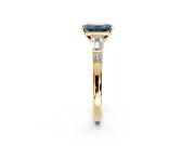 Bar-Set Engagement Ring Setting for Fancy Blue Emerald Cut Center with Tapered Baguette Accents and Prong Head in Yellow Gold