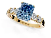 5 Stone Engagement Ring Setting for Fancy Blue Radiant Cut Center with Plain Band and Prong Head in Yellow Gold