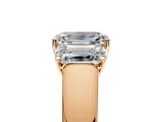 3 Stone Engagement Ring Setting for Emerald Cut Center with Raised Basket Heads and Prong Head in Rose Gold