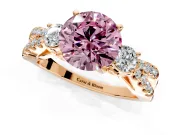 3 Stone Engagement Ring Setting for Fancy Pink Round Cut Center with Pave Split Shank and Prong Head in Rose Gold