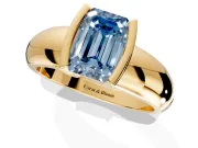 Tension Engagement Ring Setting for Fancy Blue Emerald Cut Center with Wide Flat Band and Tension Head in Yellow Gold