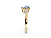3 Stone Engagement Ring Setting for Fancy Blue Heart-Shaped Center with Baguette Accents and Prong Head in Yellow Gold