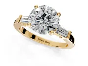 3 Stone Engagement Ring Setting for Round Cut Center with Channel Baguette Accents and Prong Head in Yellow Gold