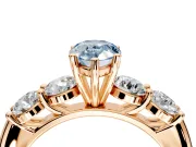5 Stone Engagement Ring Setting for Fancy Blue Pear-Shaped Center with Graduated Accents and Prong Head in Rose Gold