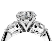 3 Stone Engagement Ring Setting for Round Cut Center with Large Pear-Shaped Accents and Prong Head in Platinum