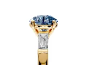 3 Stone Engagement Ring Setting for Fancy Blue Round Cut Center with Tapered Baguettes, Plain Band and Prong Head in Yellow Gold