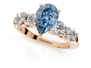 5 Stone Engagement Ring Setting for Fancy Blue Pear-Shaped Center with Graduated Accents and Prong Head in Rose Gold