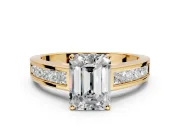 Solitaire Engagement Ring Setting for Emerald Cut Center with Princess Cut Channel Band and Prong Head in Yellow Gold