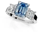 3 Stone Engagement Ring Setting for Fancy Blue Emerald Cut Center with Matching Side Accents and Prong Head in Platinum