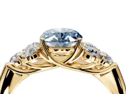Cluster Engagement Ring Setting for Fancy Blue Oval Center with Round Cut Accent Frame and Prong Head in Yellow Gold