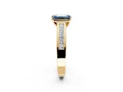 Solitaire Engagement Ring Setting for Fancy Blue Emerald Cut Center with Princess Cut Channel Band and Prong Head in Yellow Gold