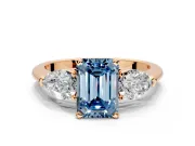 3 Stone Engagement Ring Setting for Fancy Blue Emerald Cut Center with Large Pear-Shaped Accents and Prong Head in Rose Gold