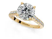 Solitaire Engagement Ring Setting for Round Cut Center with Widening Pave Band and Claw Prong Head in Yellow Gold