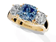 3 Stone Engagement Ring Setting for Fancy Blue Cushion Cut Center with Raised Basket Heads and Prong Head in Yellow Gold