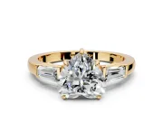 3 Stone Engagement Ring Setting for Heart-Shaped Center with Baguette Accents and Prong Head in Yellow Gold