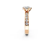 Solitaire Engagement Ring Setting for Pear-Shaped Center with Channel-Set Accents and Prong Head in Rose Gold