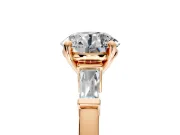 3 Stone Engagement Ring Setting for Round Cut Center with Channel Baguette Accents and Prong Head in Rose Gold