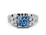 Cluster Engagement Ring Setting for Fancy Blue Princess Cut Center with Bezel Accent Clusters and Prong Head in Platinum