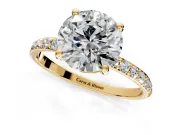 Solitaire Engagement Ring Setting for Round Cut Center with Pave Accents and Prong Head in Yellow Gold