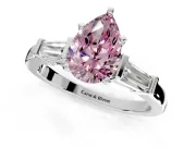 3 Stone Engagement Ring Setting for Fancy Pink Pear-Shaped Center with Channel Baguette Accents and Prong Head in Platinum