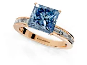 Solitaire Engagement Ring Setting for Fancy Blue Princess Cut Center with Channel Baguette Band and Prong Head in Rose Gold