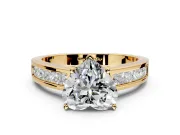 Solitaire Engagement Ring Setting for Heart-Shaped Center with Princess Cut Channel Band and Prong Head in Yellow Gold