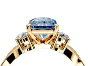 3 Stone Engagement Ring Setting for Fancy Blue Radiant Cut Center with Pave Twist Band and Prong Head in Yellow Gold