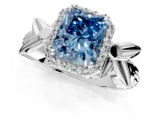 Halo Engagement Ring Setting for Fancy Blue Radiant Cut Center with Floral Band and Prong Head in White Gold