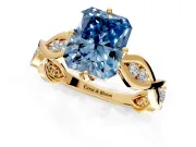 Solitaire Engagement Ring Setting for Fancy Blue Radiant Cut Center with Accented Twist Band and Leaf Prong Head in Yellow Gold