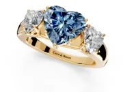 3 Stone Engagement Ring Setting for Fancy Blue Heart-Shaped Center with Raised Basket Heads and Prong Head in Yellow Gold