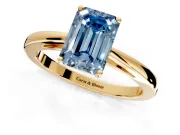 Solitaire Engagement Ring Setting for Fancy Blue Emerald Cut Center with Open Cathedral Shoulders and Prong Head in Yellow Gold