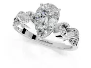Leaf Engagement Ring Setting for Pear-Shaped Center with Milgrain Accent Band and Prong Head in Platinum
