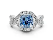 Halo Engagement Ring Setting for Fancy Blue Cushion Cut Center with Pave Infinity Twist Band and Prong Head in White Gold