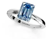 Solitaire Engagement Ring Setting for Fancy Blue Emerald Cut Center with Open Cathedral Shoulders and Prong Head in Platinum