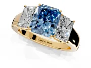 3 Stone Engagement Ring Setting for Fancy Blue Radiant Cut Center with Raised Basket Heads and Prong Head in Yellow Gold