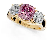 3 Stone Engagement Ring Setting for Fancy Pink Cushion Cut Center with Raised Basket Heads and Prong Head in Yellow Gold