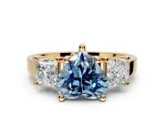 3 Stone Engagement Ring Setting for Fancy Blue Heart-Shaped Center with Matching Side Accents and Prong Head in Yellow Gold