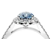 Halo Engagement Ring Setting for Fancy Blue Pear-Shaped Center with Narrowing Pave Band and Prong Head in White Gold