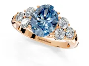 Cluster Engagement Ring Setting for Fancy Blue Oval Center with Round Cut Accent Frame and Prong Head in Rose Gold