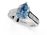 Solitaire Engagement Ring Setting for Fancy Blue Pear-Shaped Center with Channel Band and Double Claw Prong Head in Platinum