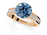Solitaire Engagement Ring Setting for Fancy Blue Round Cut Center with Princess Cut Channel Band and Prong Head in Rose Gold
