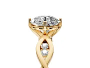 Solitaire Engagement Ring Setting for Round Cut Center with Accented Twist Band and Leaf Prong Head in Yellow Gold
