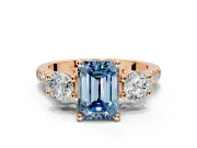 3 Stone Engagement Ring Setting for Fancy Blue Emerald Cut Center with Crossover Basket, Pave Band and Prong Head in Rose Gold
