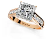 Solitaire Engagement Ring Setting for Princess Cut Center with Cathedral Channel Band and Prong Head in Rose Gold