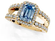 Halo Engagement Ring Setting for Fancy Blue Emerald Cut Center with Wide-Open Pave Split Shank and Prong Head in Yellow Gold