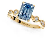 Solitaire Engagement Ring Setting for Fancy Blue Emerald Cut Center with Milgrain Bezel Accents and Prong Head in Yellow Gold
