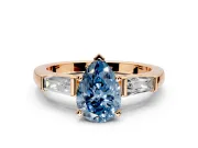 3 Stone Engagement Ring Setting for Fancy Blue Pear-Shaped Center with Tapered Baguettes, Plain Band and Prong Head in Rose Gold