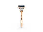 3 Stone Engagement Ring Setting for Fancy Blue Emerald Cut Center with Large Pear-Shaped Accents and Prong Head in Rose Gold