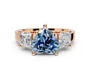 3 Stone Engagement Ring Setting for Fancy Blue Heart-Shaped Center with Matching Side Accents and Prong Head in Rose Gold