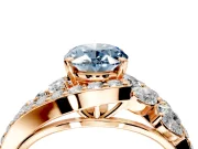 Halo Engagement Ring Setting for Fancy Blue Oval Center with Marquise and Pave Bypass Band and Prong Head in Rose Gold